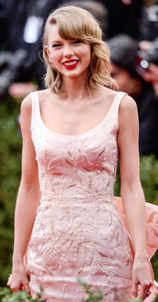 Taylor Swift's Iconic Met Gala 2014 Appearance: A Fusion of Elegance and Modern Glamour In A Pink Gown