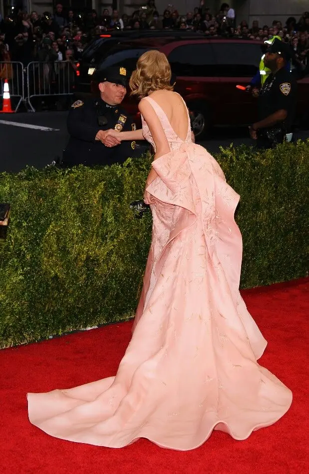 Taylor Swift's Iconic Met Gala 2014 Appearance: A Fusion of Elegance and Modern Glamour In A Pink Gown