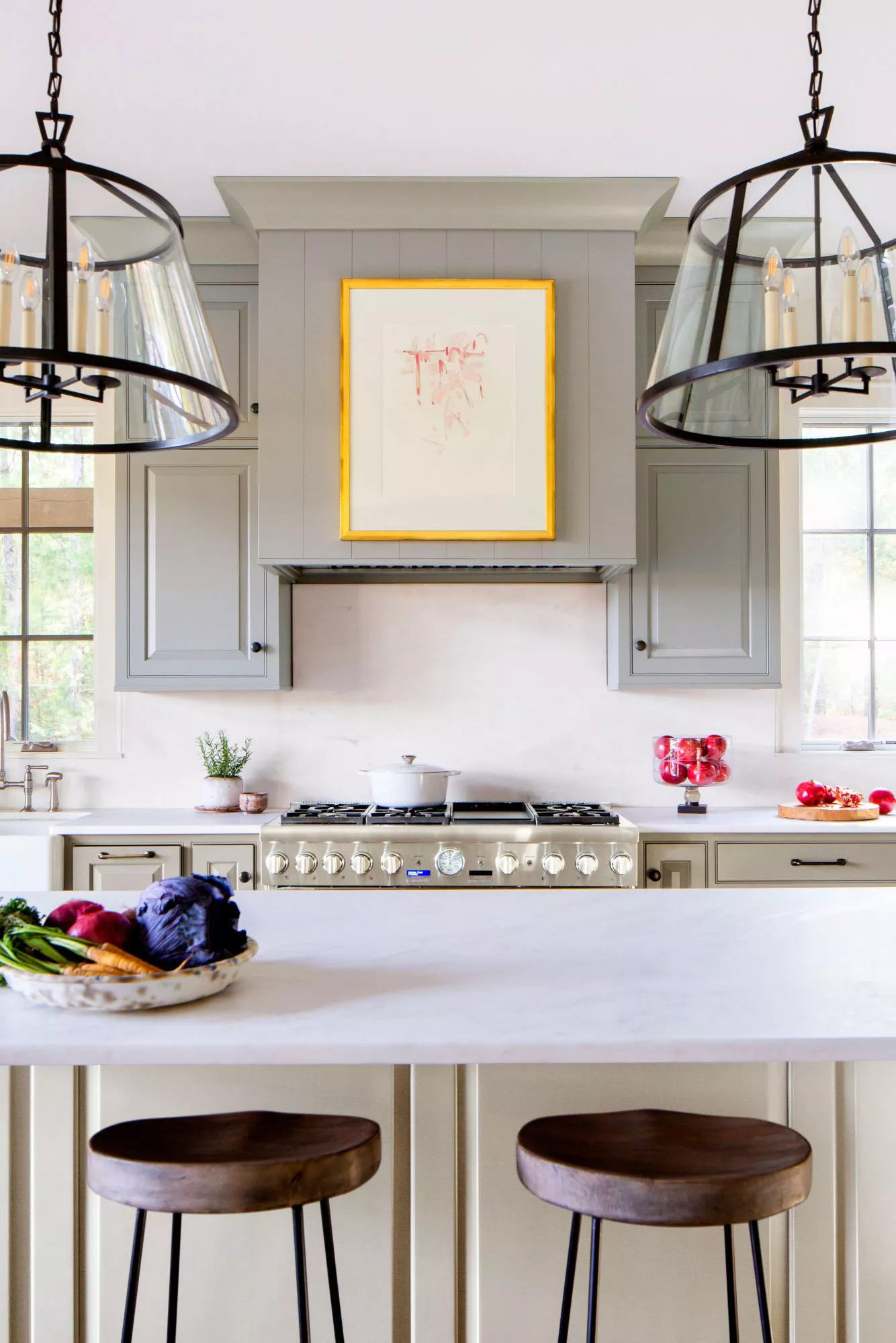 Gray and White Kitchen, Glass Pendants, Art on Vent Hood