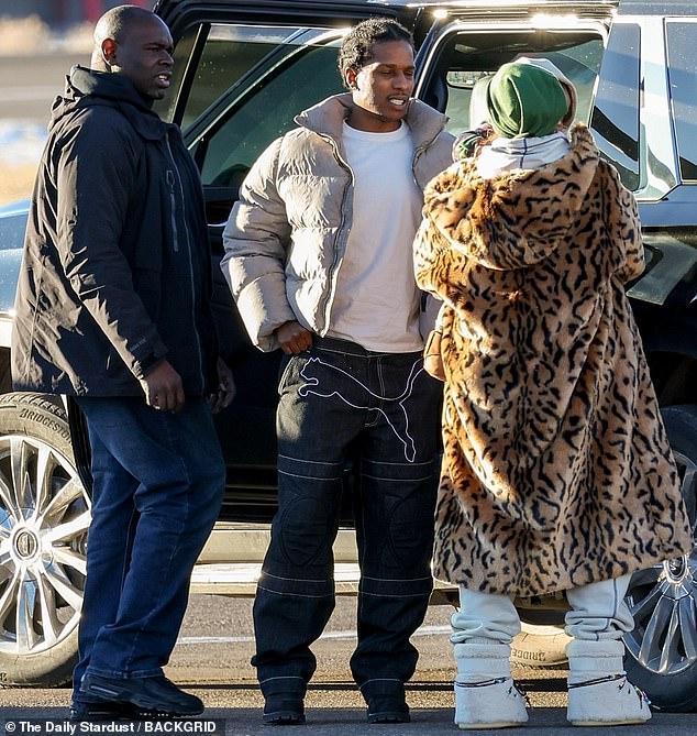 Meanwhile A$AP Rocky was still the image of Yuletide cheer over a week after Christmas , beaming as he crossed the tarmac with his ladylove and children