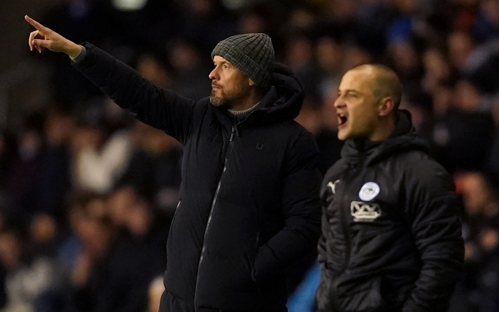 Man Utd boss Erik ten Hag gives pointers as Wigan chief Shaun Maloney looks on