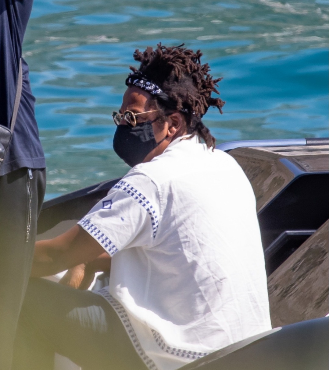 Jay opted for a black bandana to keep his hair back and a white summer shirt