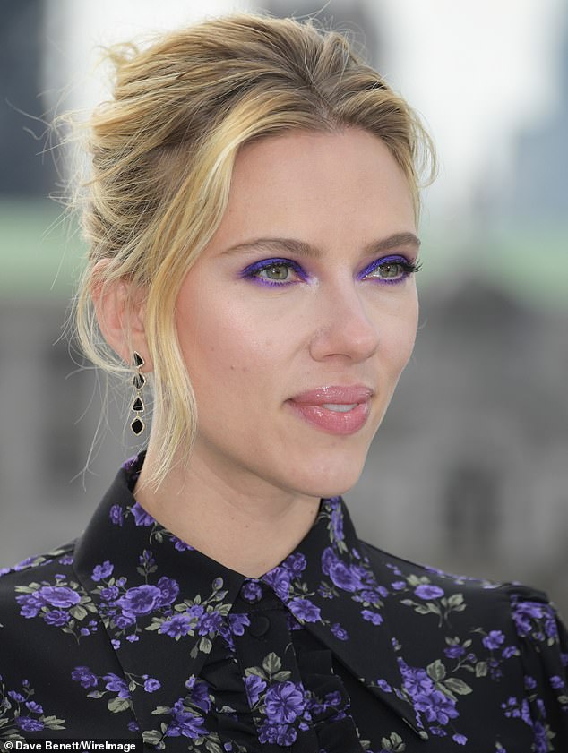 Make-up: Scarlett opted for a dramatic make-up look, including a bold purple smokey-eye which perfectly tied her look together with the pop of colour