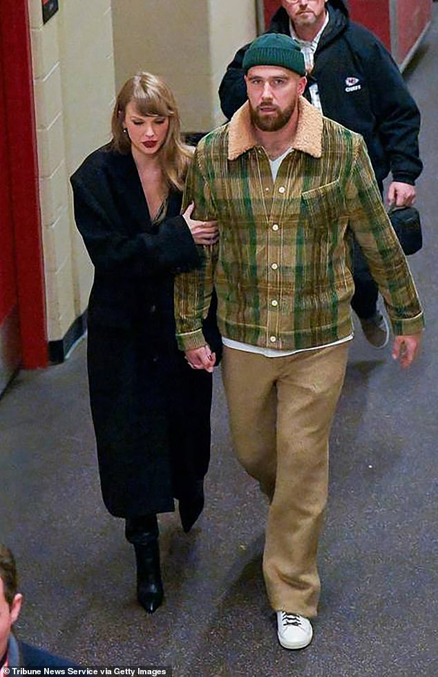 The stars hold hands as they leave after the Buffalo Bills defeated the Kansas City Chiefs, 20-17, in Kansas City, Missouri in December