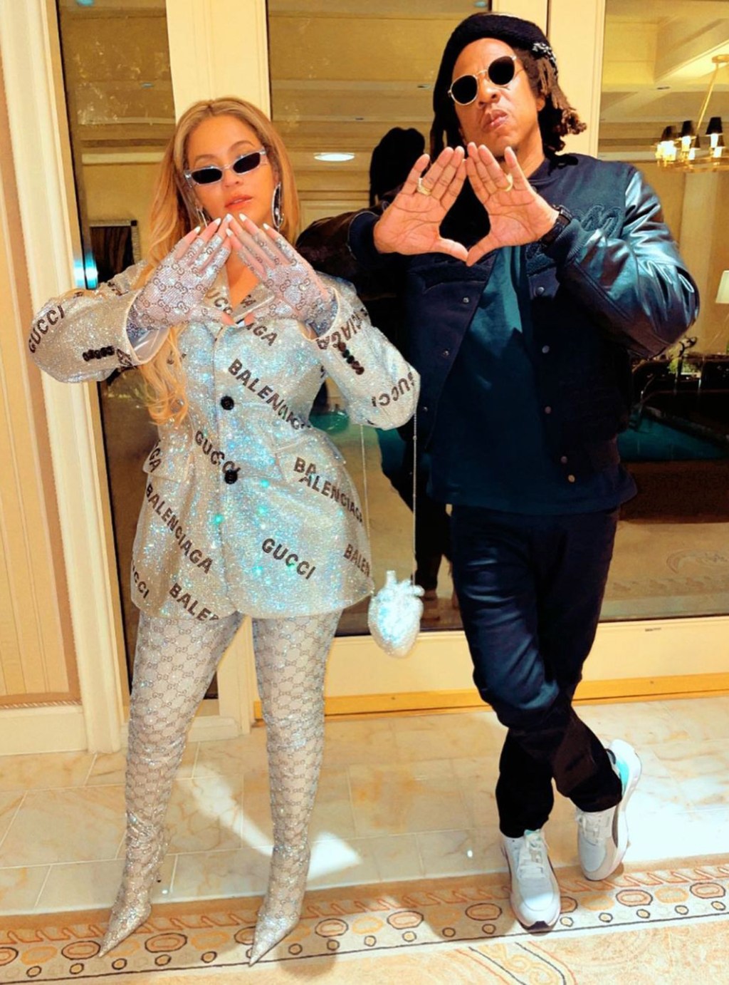 Beyoncé wearing a crystal-covered outfit with Jay-Z