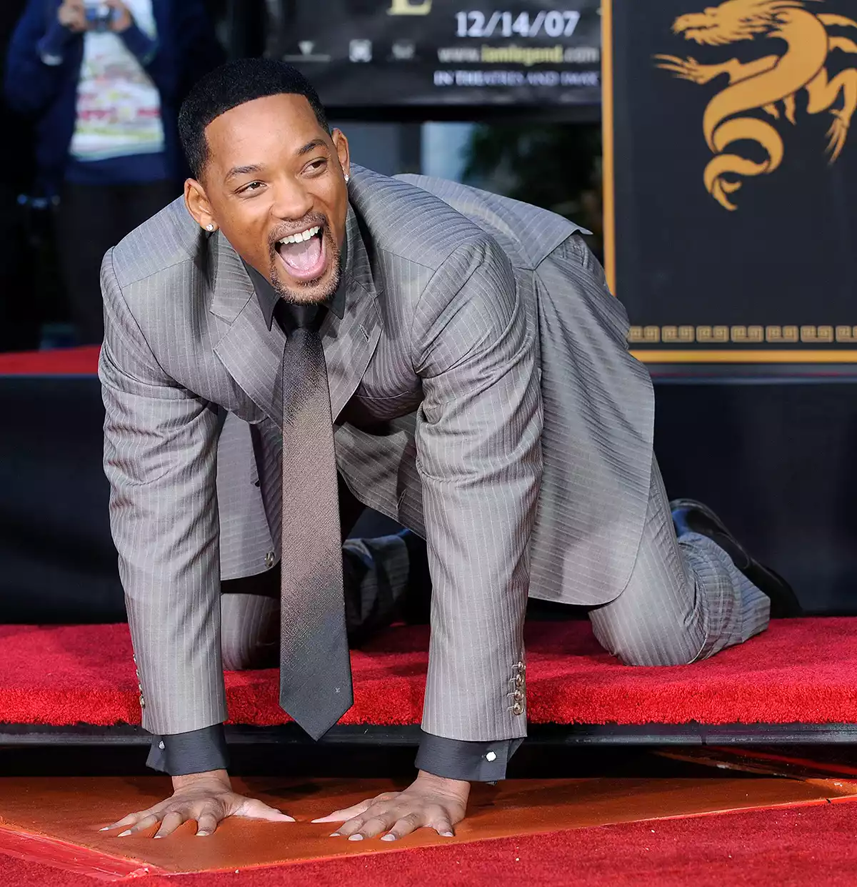 Actor Will Smith puts his hands in cement in the forecourt of Grauman's Chinese Theatre in Los Angeles