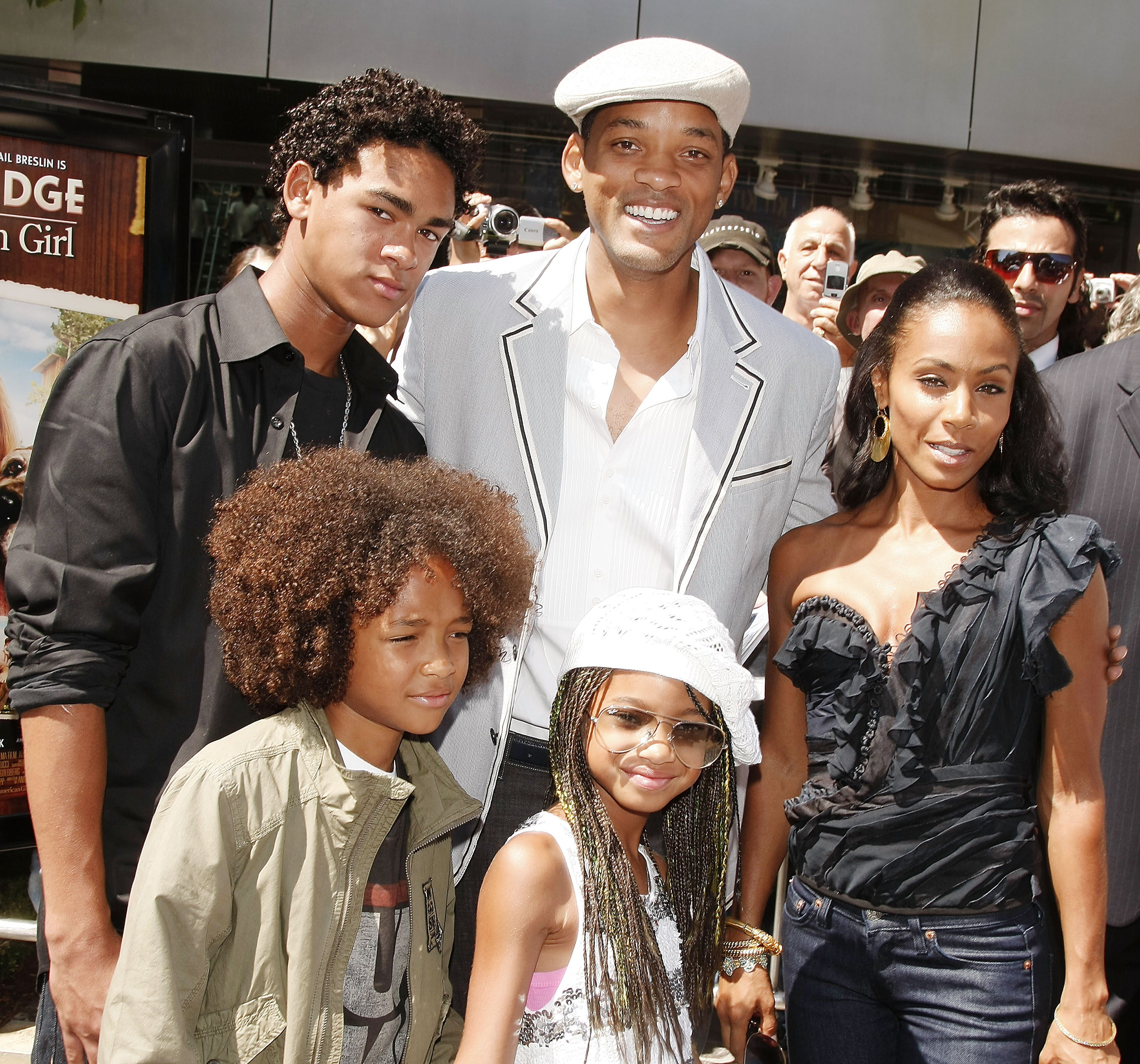 An old photo of Will Smith and Jada Pinkett Smith with their kids.