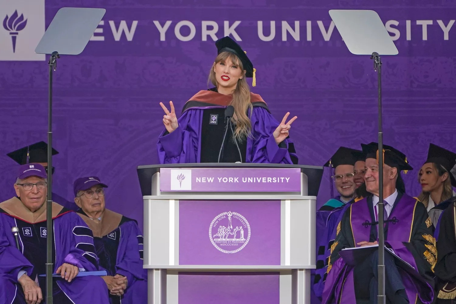 Taylor Swift speaks during a graduation ceremony for New York University at Yankee Stadium in New York, Wednesday, May 18, 2022.