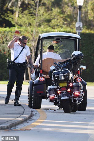 He subsequently chat with a police officer during the daytime outing