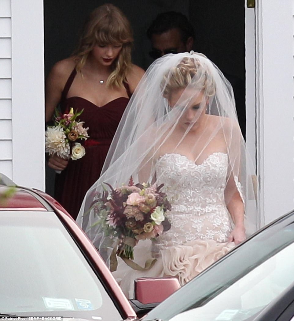 Stunning: The dress pulled into a gorgeous strapless neckline, before it perfectly hugged her slim frame all the way down with its delicate white lace pattern 