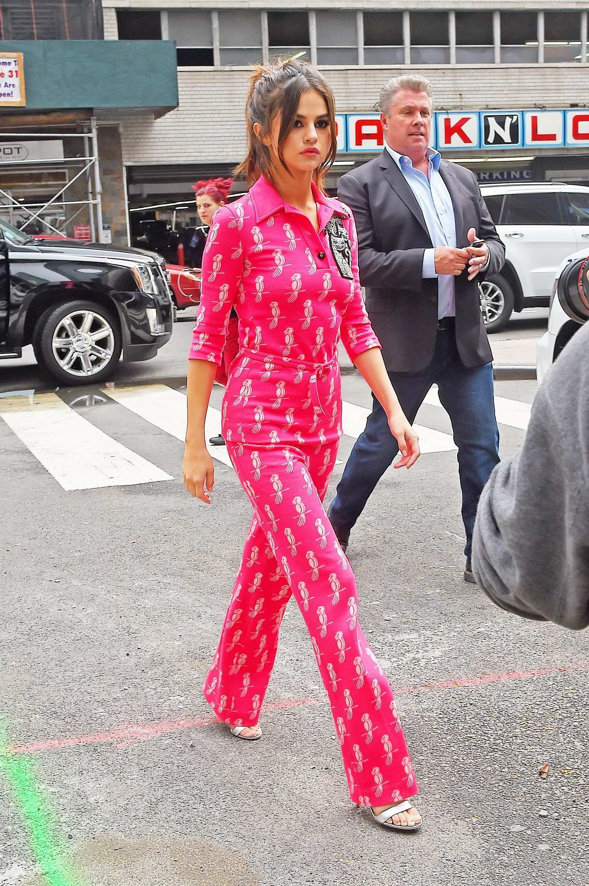 selena gomez in a pink jumpsuit arrives at another radio station in new  york-050617_1