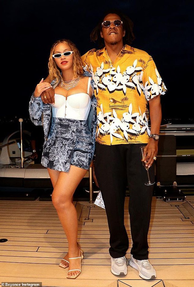 Happy couple: Beyonce was seen being held by her husband, Jay-Z, in a shot from one of three photosets that were shared to her Instagram account on Saturday
