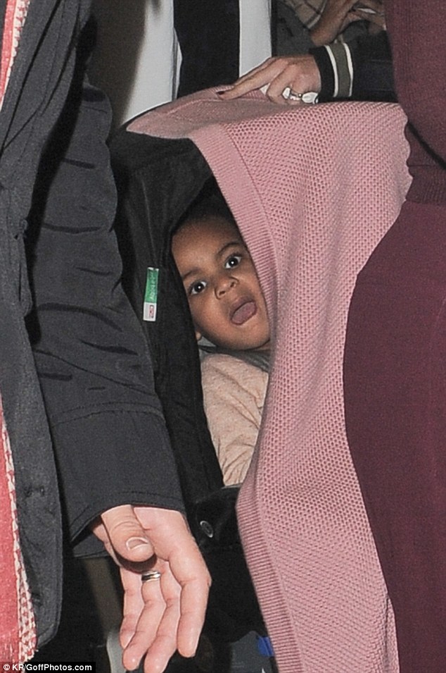 Peekaboo: It looked like Blue may have been having a nap as she arrived at St Pancras with a blanket over her buggy