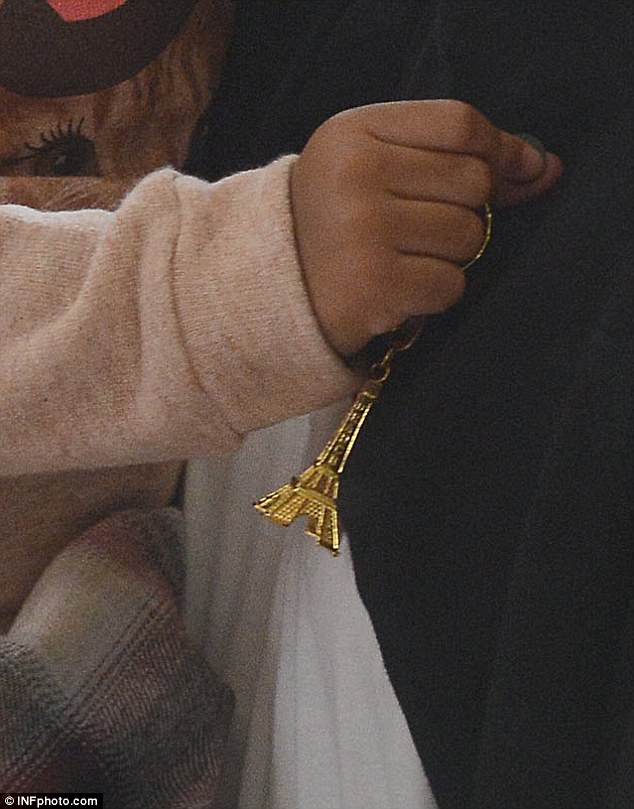 Token: The two-year-old clutched an Eiffel Tower key chain