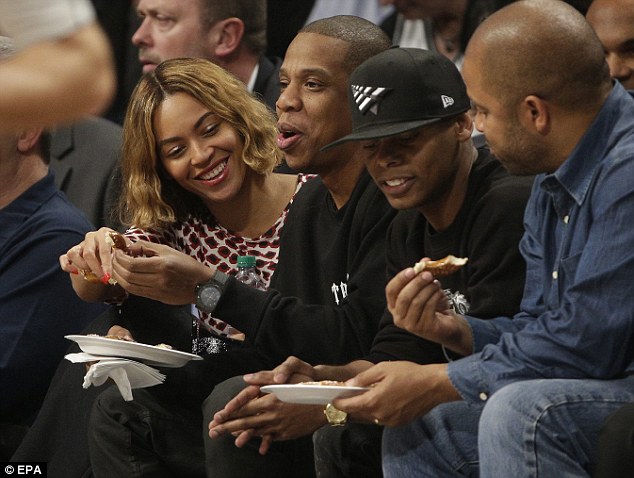 Good times: The couple seemed in great spirits as they watched the Nets' home opening game