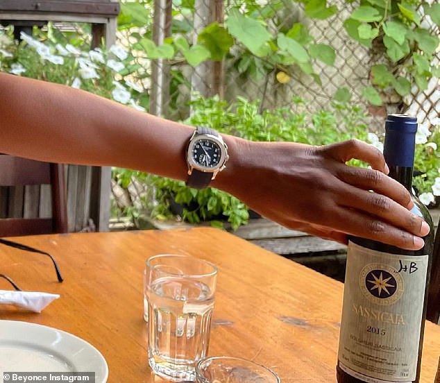 Living in style: She also snapped a photo of Jay grabbing the bottle, revealing that it was the well-regarded Italian Bordeaux-style wine Sassicaia