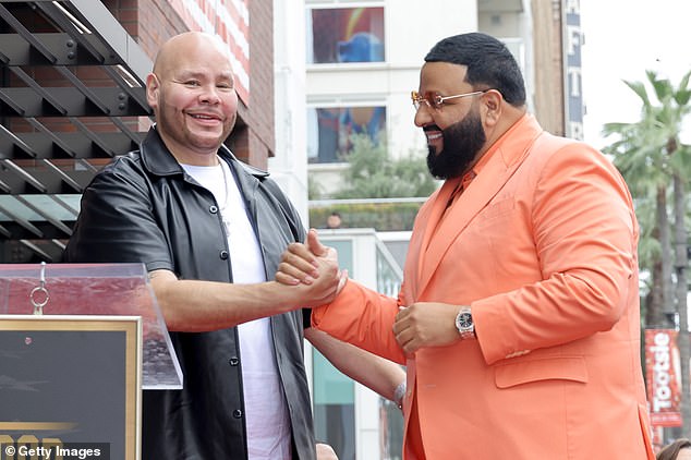 Proud dad: After posing for solo shots with his star, he was joined by his five-year-old son Asahd Tuck, who wore a colorful sweatsuit