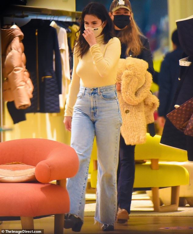 Burn that cash: Selena Gomez has been in Manhattan for work reasons. But the Wolves singer found some time on Monday to do some shopping at a Louis Vuitton store with a friend