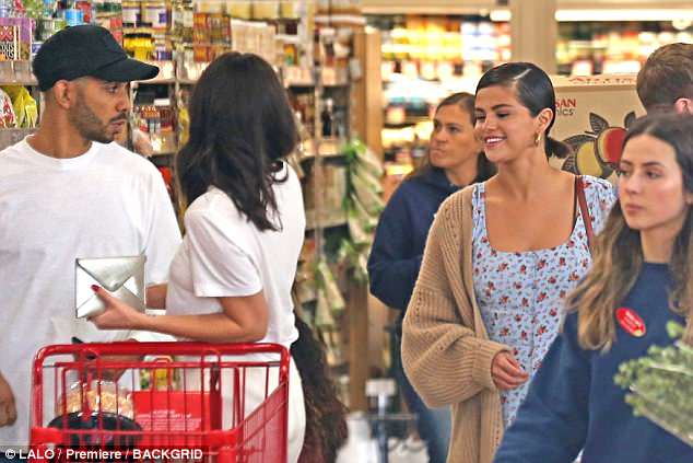 Shopper: Selena appeared to need a few refreshments as she stopped by a local Trader Joe's grocery store and left carrying a paper bag full of goodies