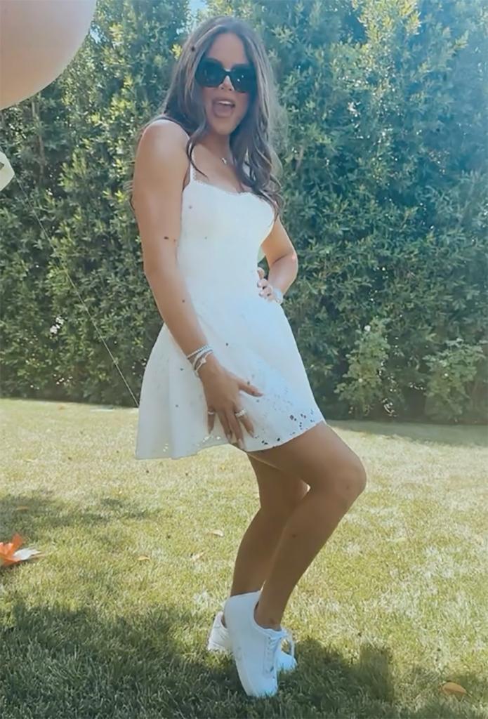 khloe kardashian wearing a short white dress